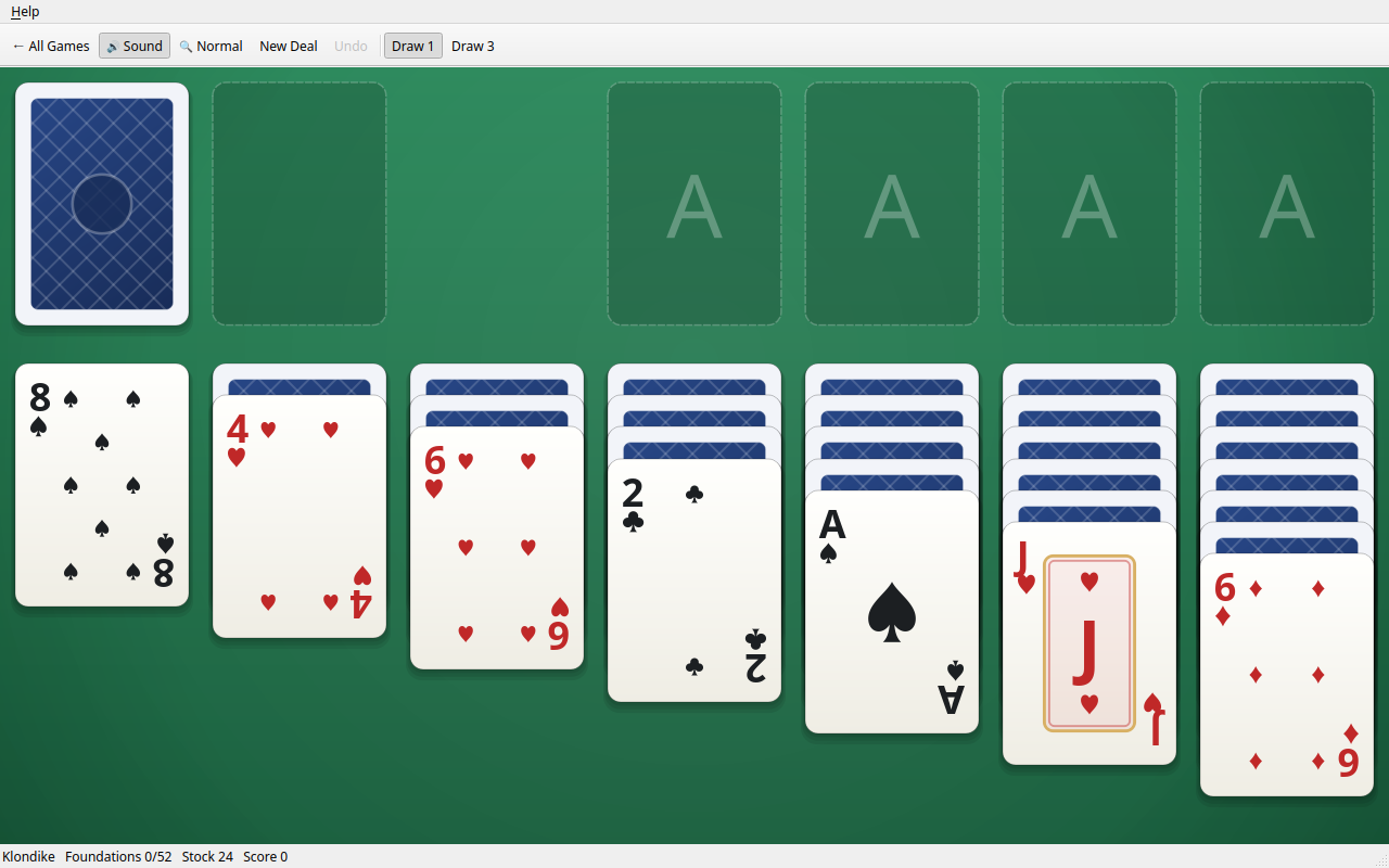 A new game of Klondike solitaire on a green table, with the draw pile top left, four empty ace spaces top right, and seven columns of large, clearly printed cards below.